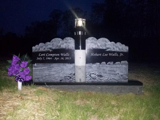 South Boston Memorials - Custom granite and stainless steel lighthouse memorial by South Boston Memorials.  Patterned after the lighthouse at Oak Island, NC with a working solar light that can be accessible for maintenance.